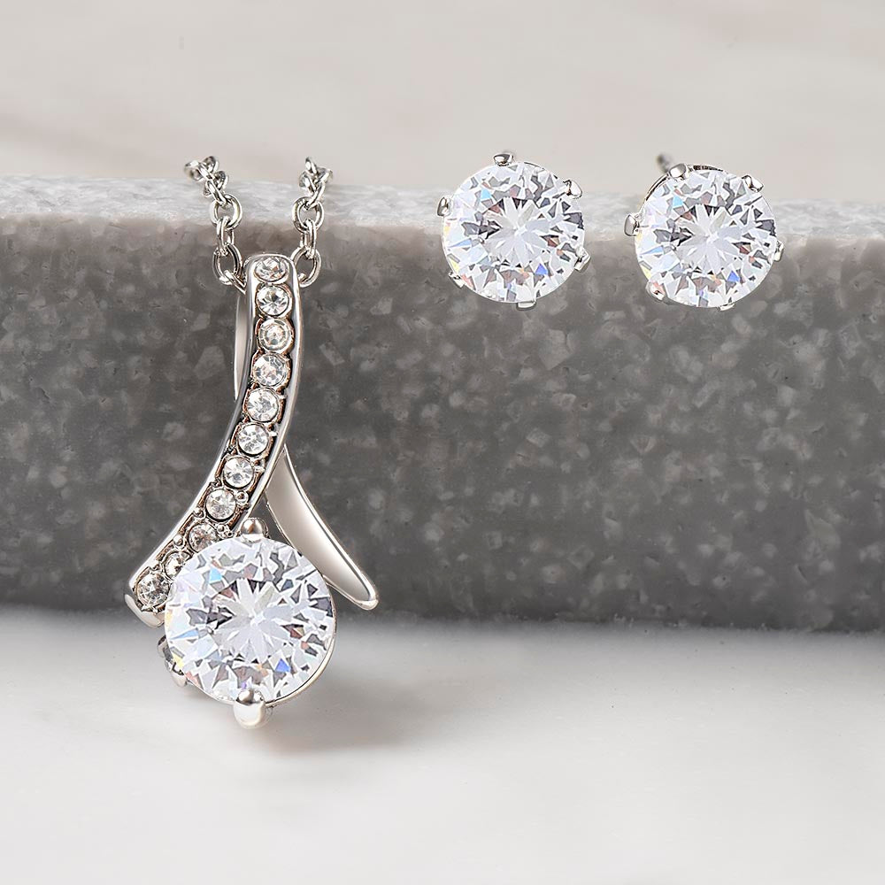 TO MY AMAZING GRANDDAUGHTER WITH THE ALLURING NECKLACE AND EARRINGSBECAUSE SHE IS LOVED MORE THAN SHE KNOWS.